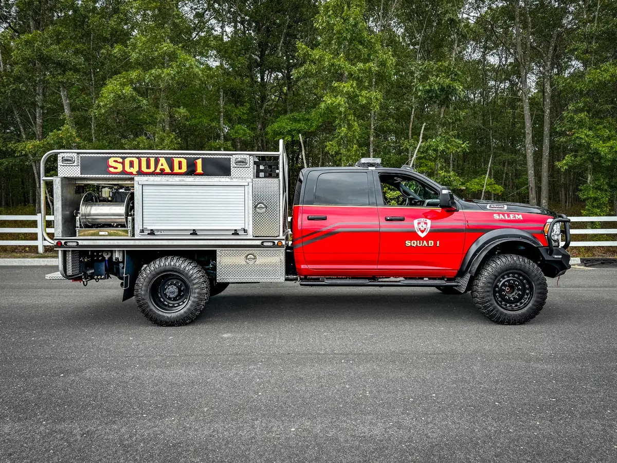 Right-side profile showing cab, side body, and rear wheel/tire area.
